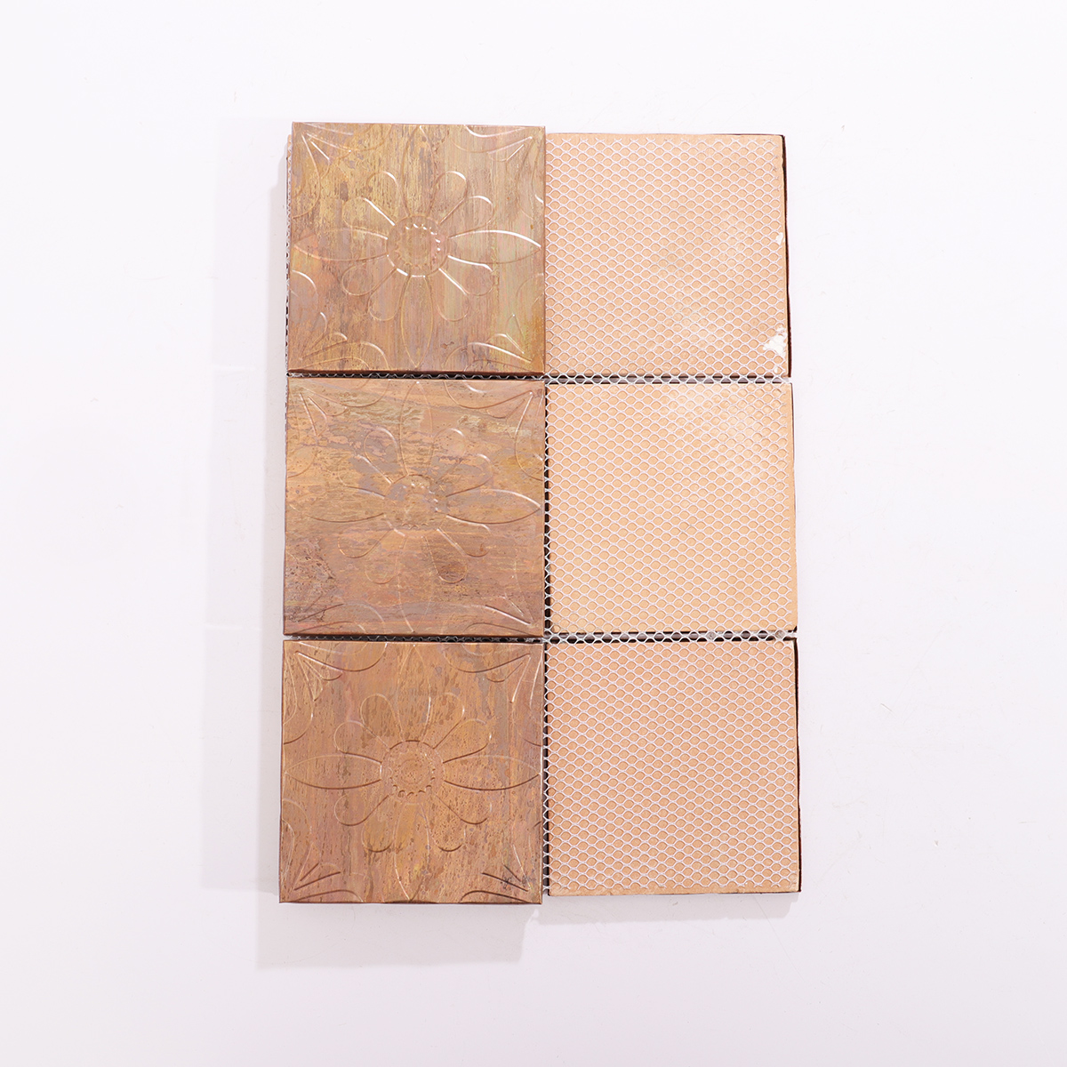 Backside of antique copper mosaic tiles, showing support structure.