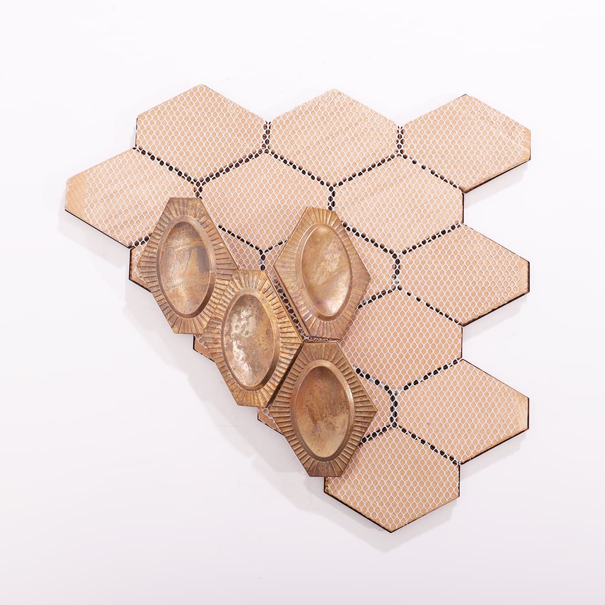 Backside of the hexagonal copper mosaic tiles, revealing structural backing.