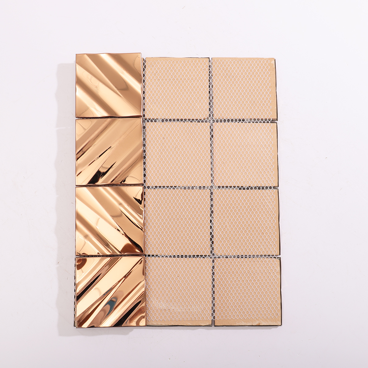 Backside of the rose gold stainless steel wall tile, showing structured support.