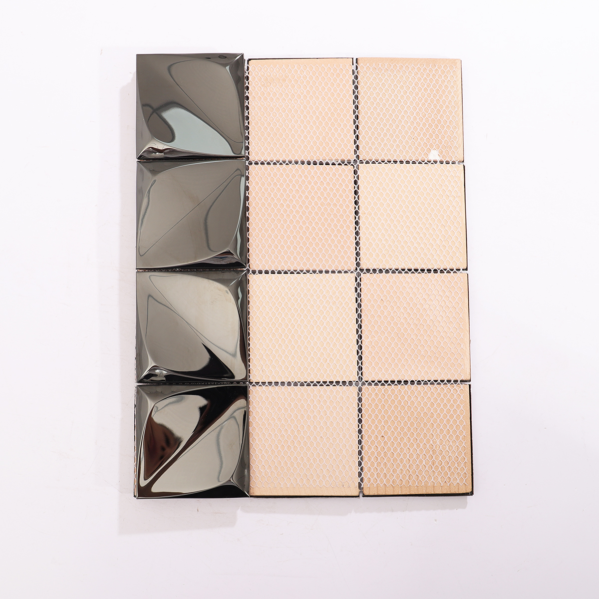 Rear view of 3D glossy black stainless steel mosaic tiles, highlighting structured backing.