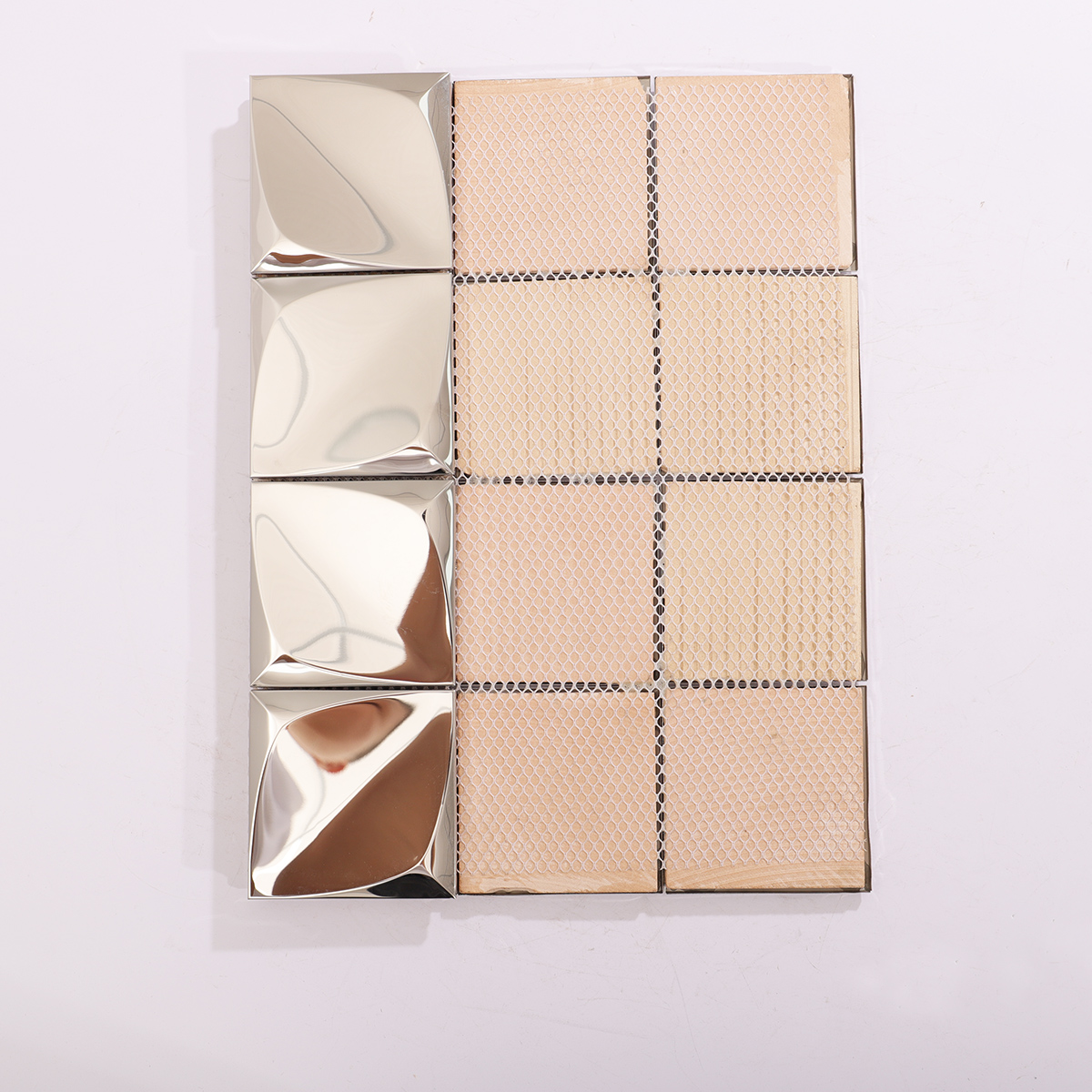 Backside of 3D silver stainless steel mosaic tiles, showing structural support.