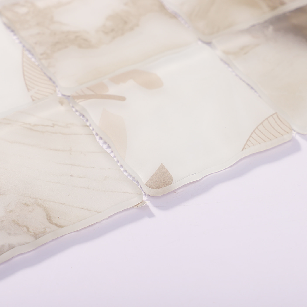 Edge detail of beige cream botanical wavy square glass mosaic tiles