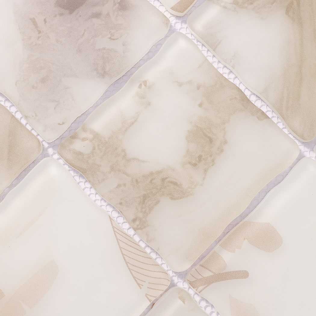 Surface detail of beige cream wavy glass mosaic tiles with marble patterns