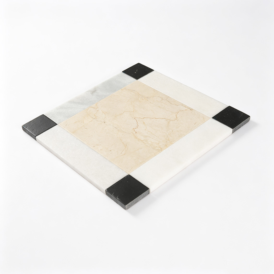 Perspective view of beige marble floor medallion with black corner accents
