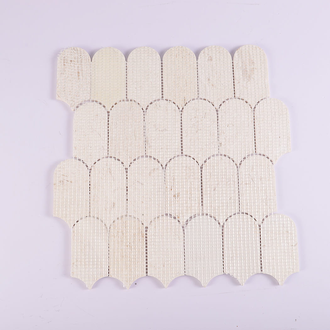 Back view of beige marble mosaic tile with mesh backing