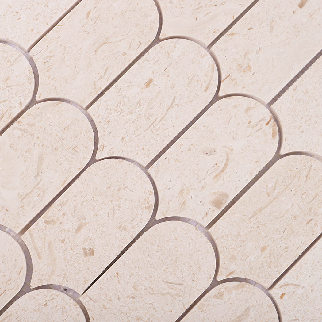 Detailed pattern of arc shape beige marble mosaic tiles