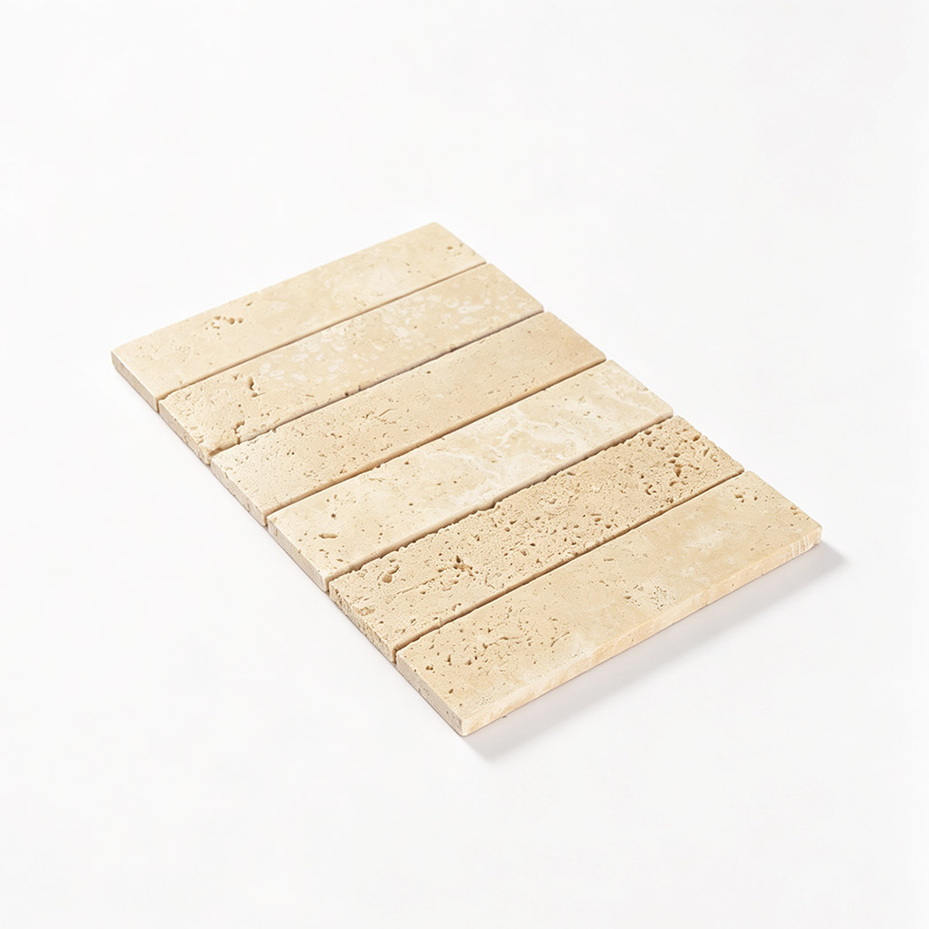 Full sheet of beige travertine rectangular mosaic tiles on a white background
