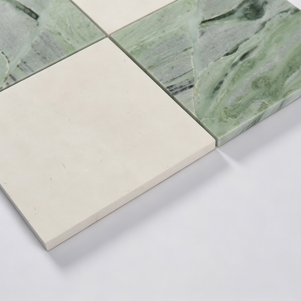 Edge detail of beige and light green marble checkered mosaic tile