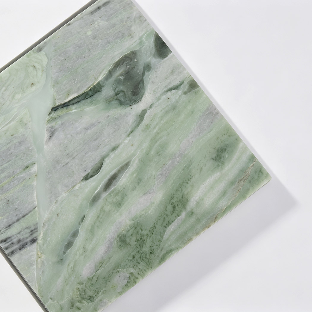 Light green marble close-up from beige and green checkered mosaic tile