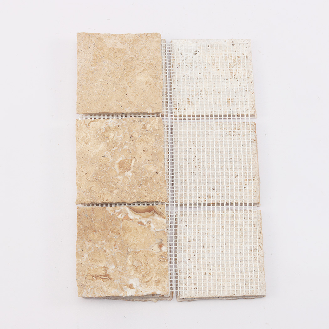 Back view of beige limestone square mosaic tile with mesh backing