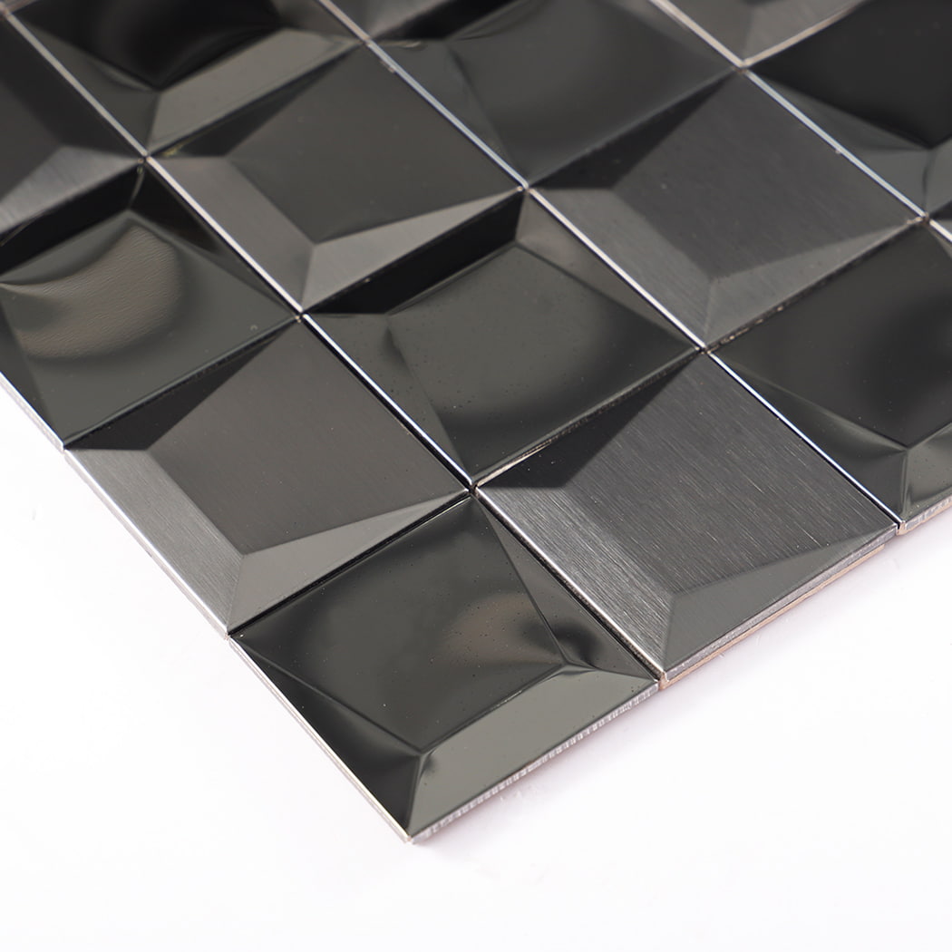 Close-up of beveled black 3D stainless steel mosaic tile edges.