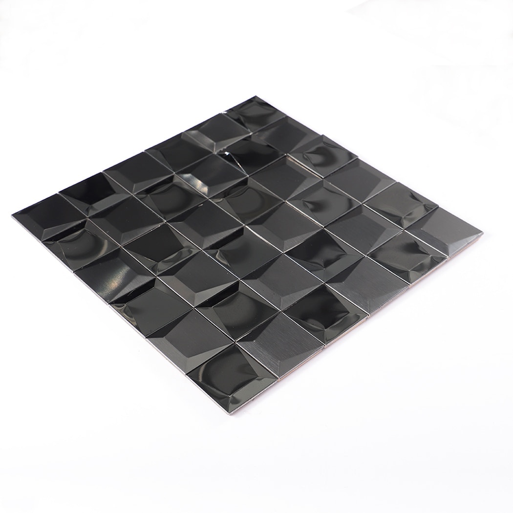 Angled view of black 3D stainless steel mosaic tile sheet.