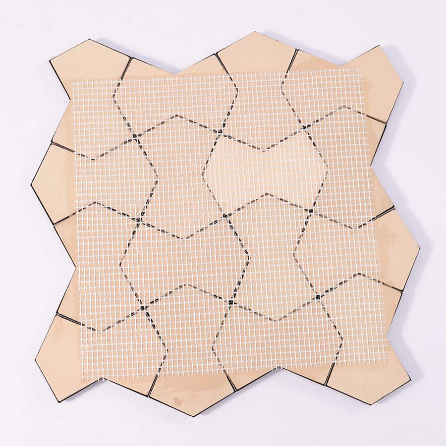 Back view of black 3D stainless steel wall tile with mesh