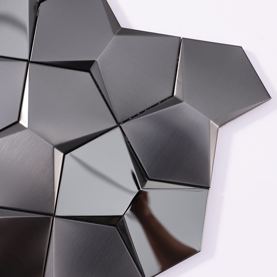 Corner view of black 3D stainless steel wall tile