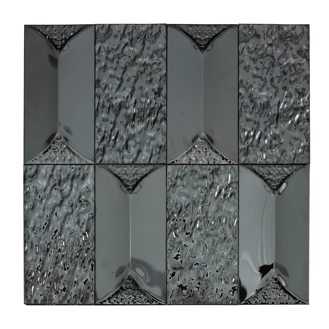 A detailed view of a sheet of 3D rectangular black stainless steel self adhesive mosaic tiles.