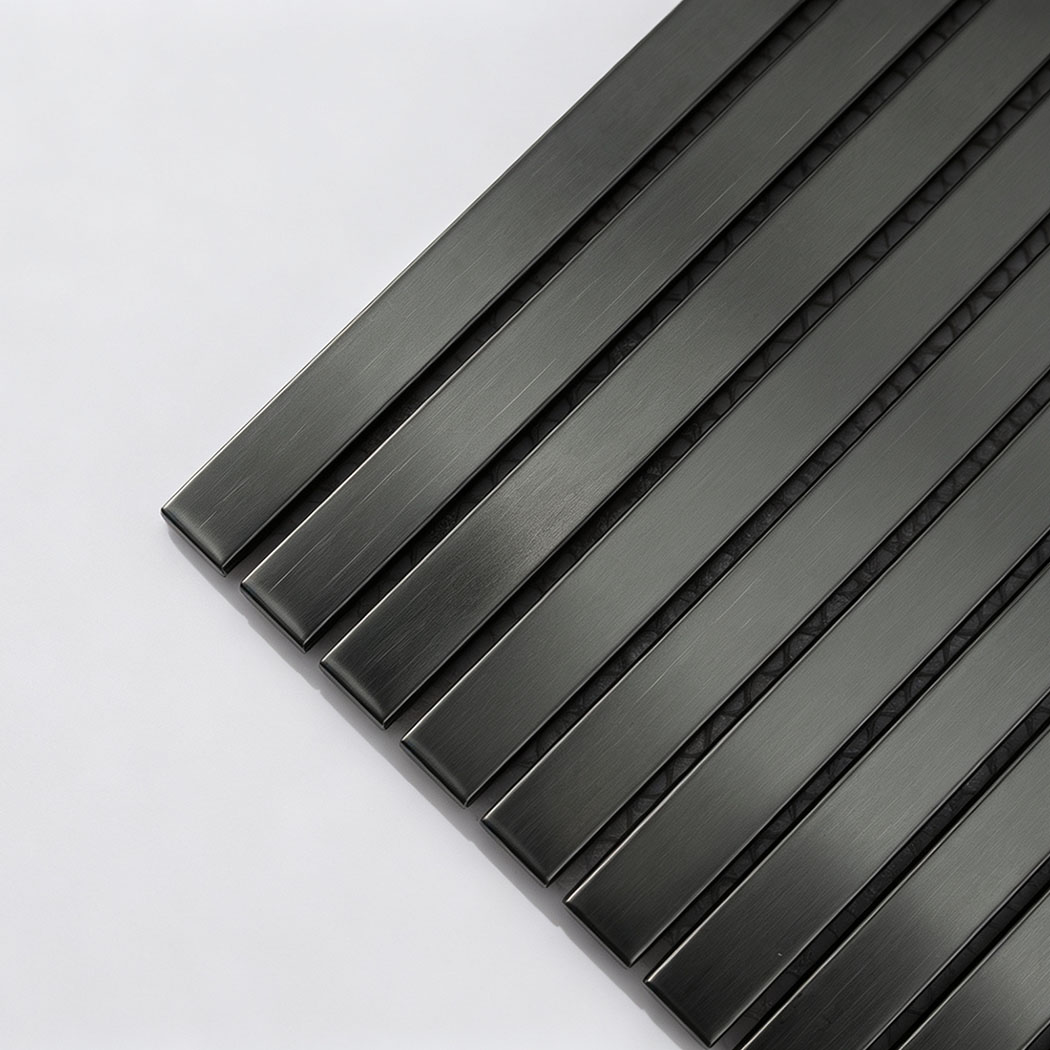 Corner close-up of black brushed stainless steel ribbon tile