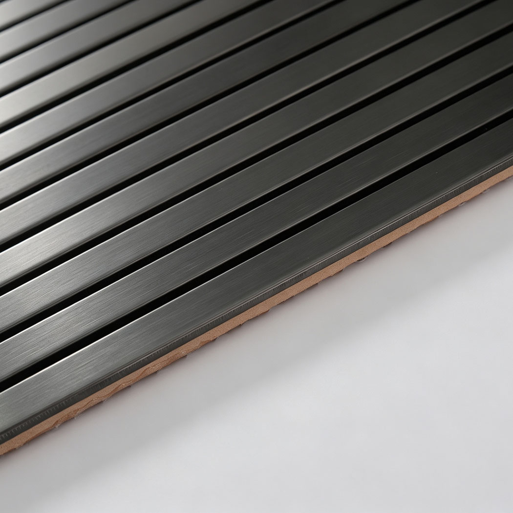 Edge detail of black brushed stainless steel ribbon tile sheet