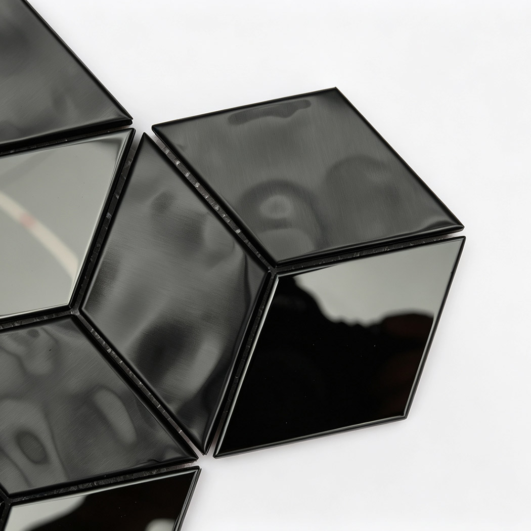 Close-up of black diamond mosaic tile with brushed and mirror metal surfaces