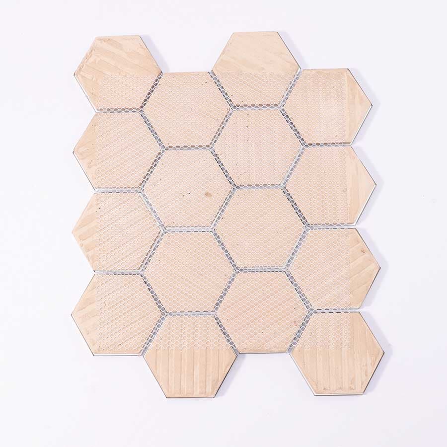 Back view of black and grey hexagon aluminum mosaic tile sheet with mesh backing