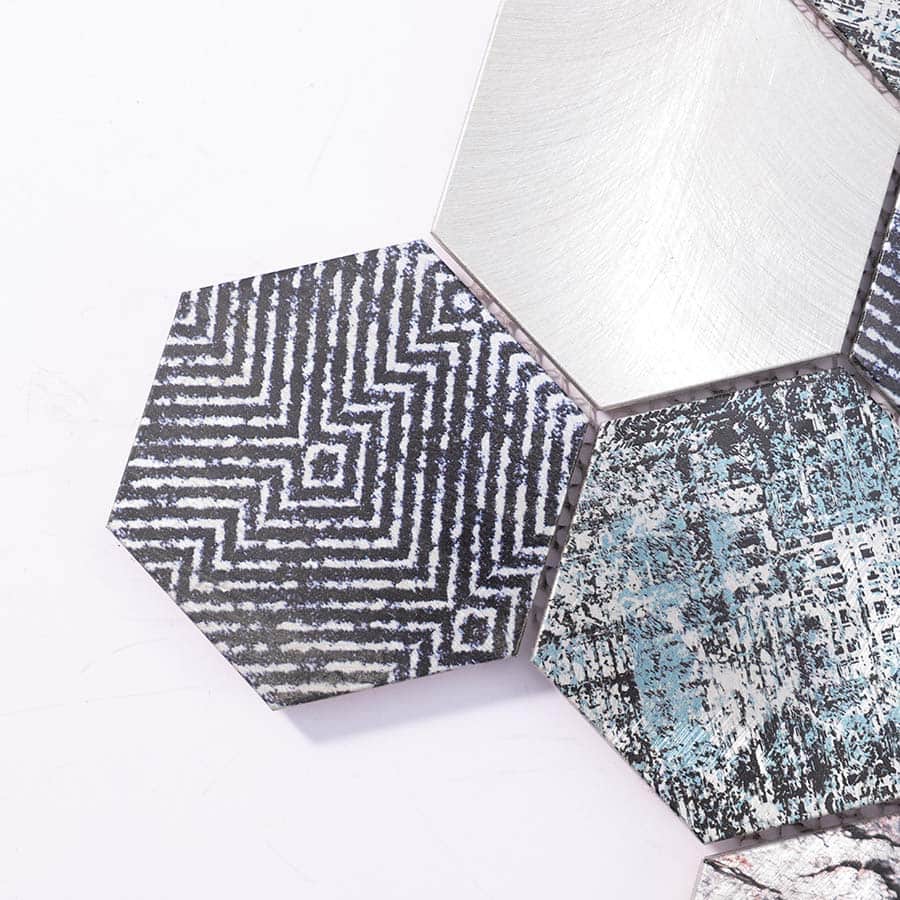 Close-up of textured black and grey hexagon aluminum mosaic tile