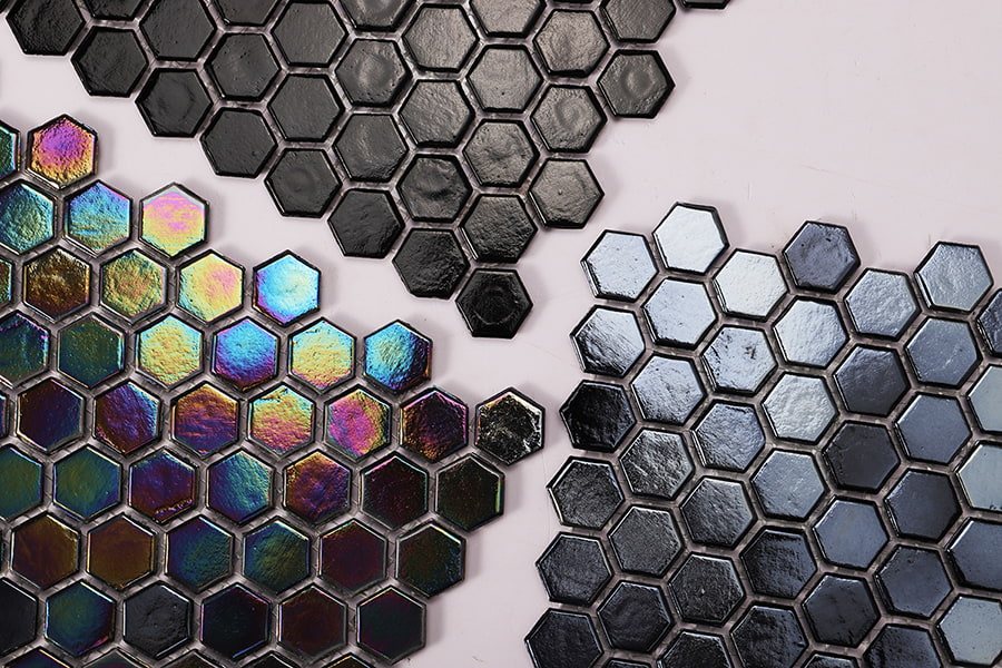 Black hexagon mosaic tiles featuring iridescent glass, glossy finish, and mirror metal