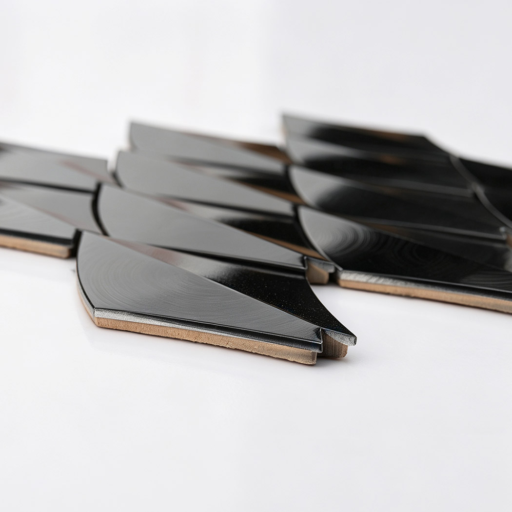 Side view of black leaf aluminum mosaic tiles showing layered construction