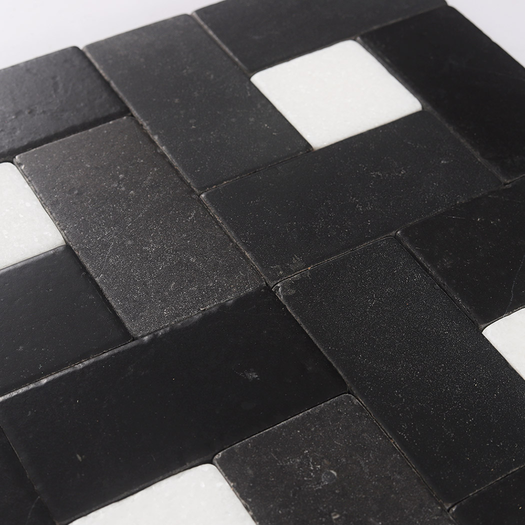 Detailed view of black marble rectangles with white square accents