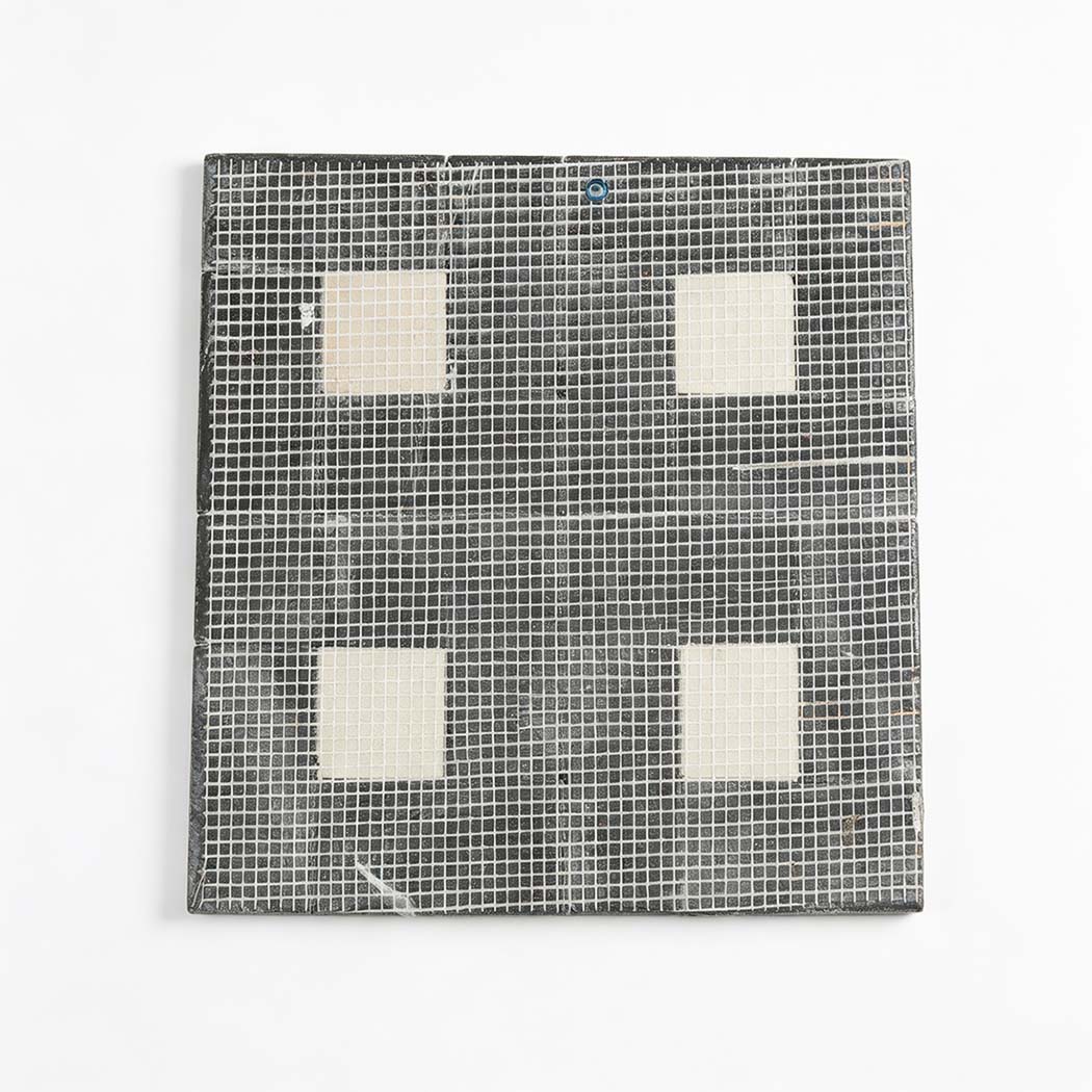 Rear mesh mounting of black pinwheel marble tile with cream square inserts