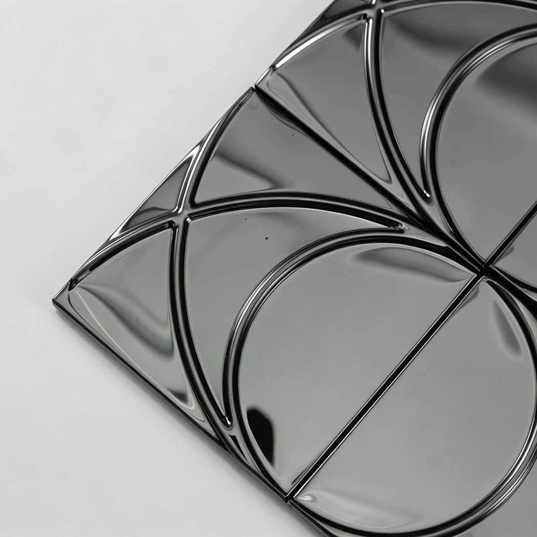 Corner close-up of black mirror stainless steel circle mosaic tile