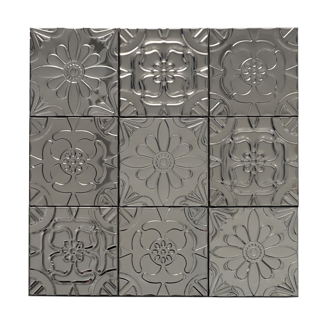 Front view of a black embossed patchwork mosaic tile sheet with mixed floral designs.