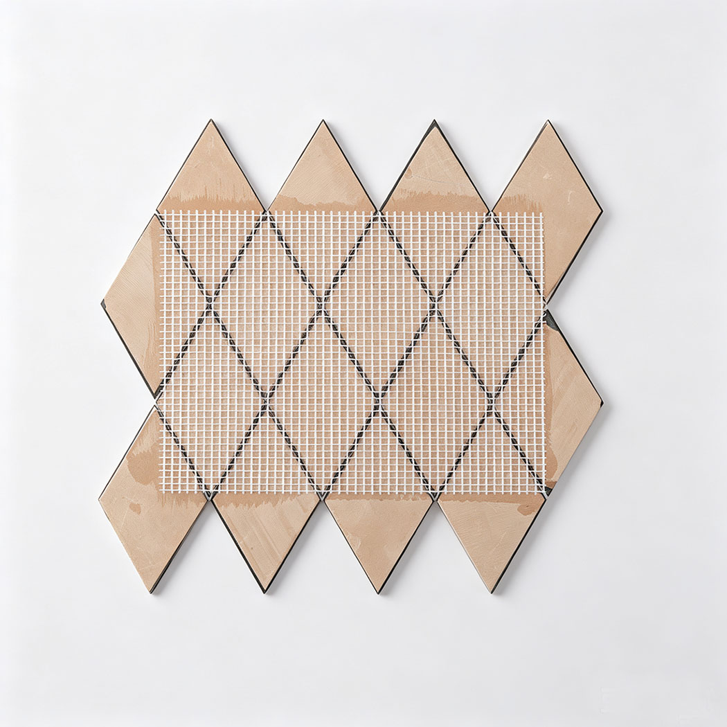Back view of black and rose gold diamond metal mosaic tile sheet with mesh backing