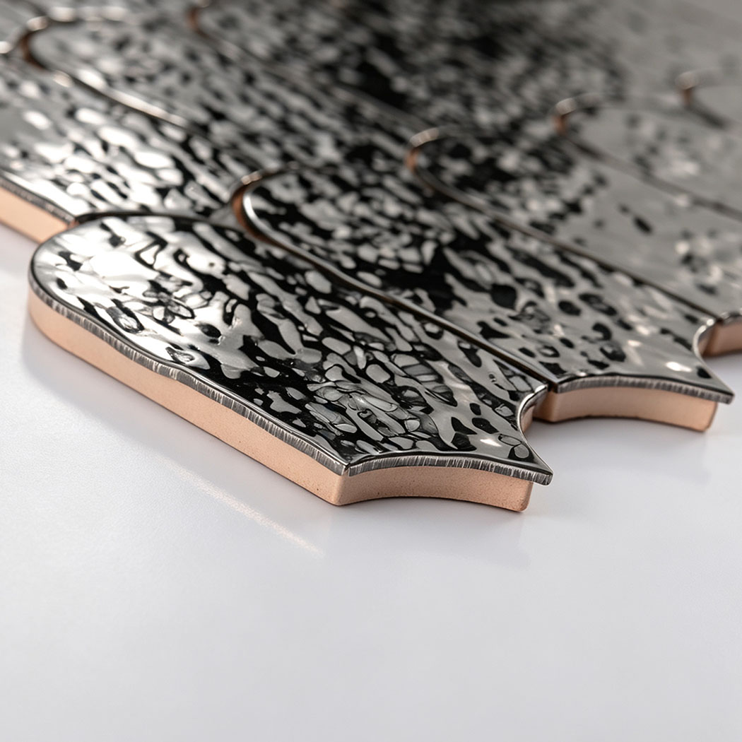 Side detail showing the thickness of black silver ripple fan metal mosaic tiles