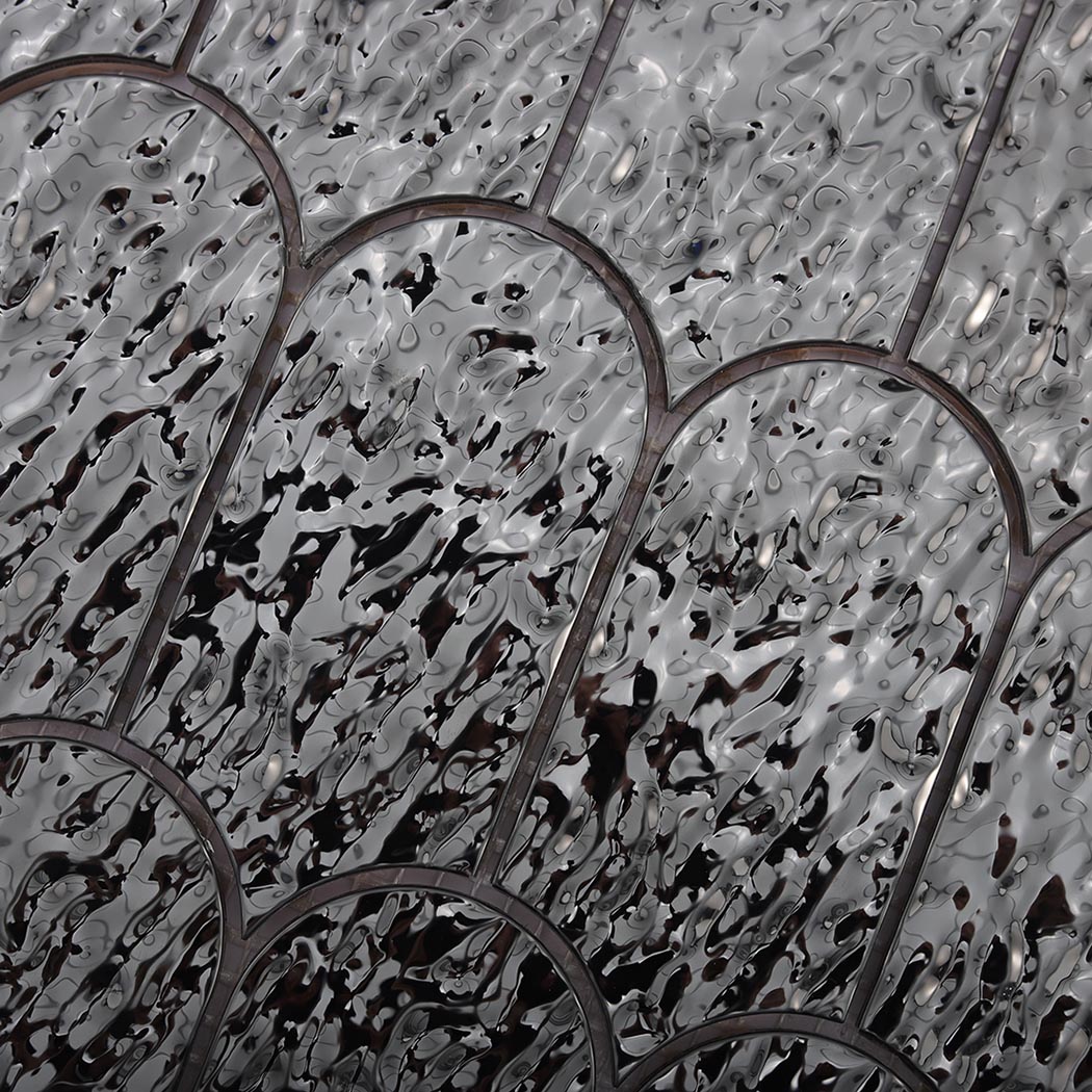Detailed texture of glossy black silver ripple fan metal mosaic tiles