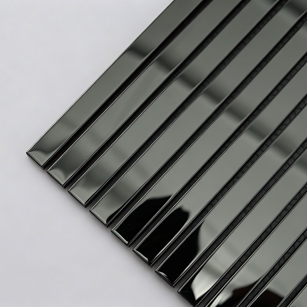 Corner close-up of reflective black stainless steel pencil shower tile
