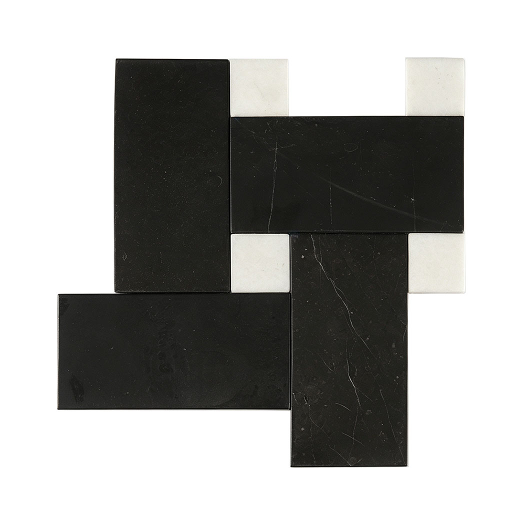 Black rectangular marble tiles with white square accents in a geometric pattern