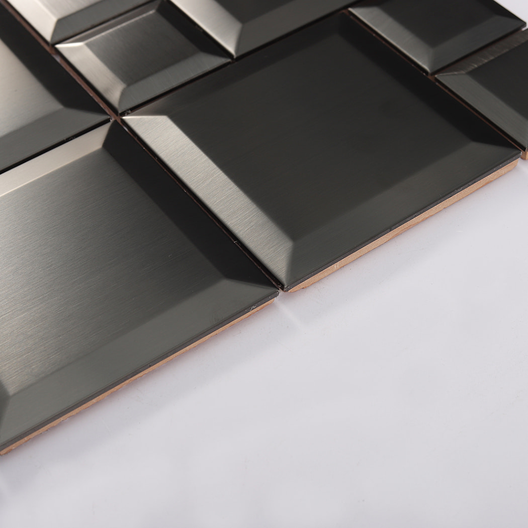 Surface texture of black brushed metal mosaic tile with subtle linear grain