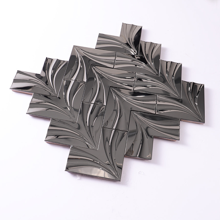 Angled view of black mirror groutless herringbone metal mosaic tile sheet
