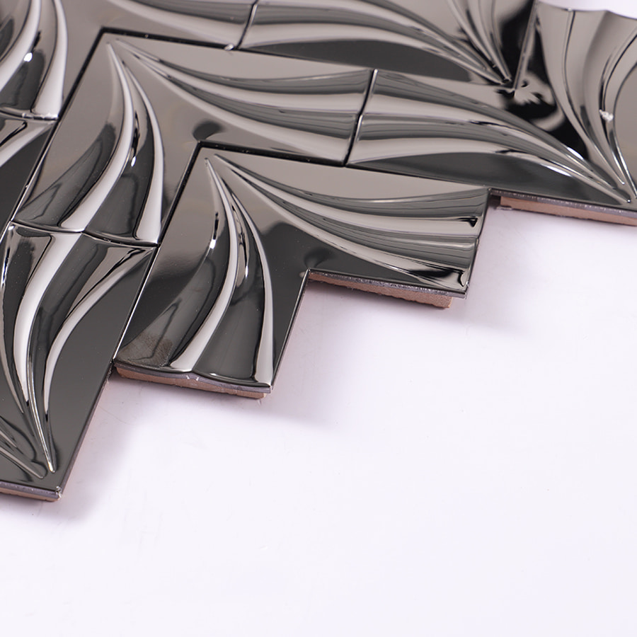 Edge view of black mirror groutless herringbone metal mosaic tile