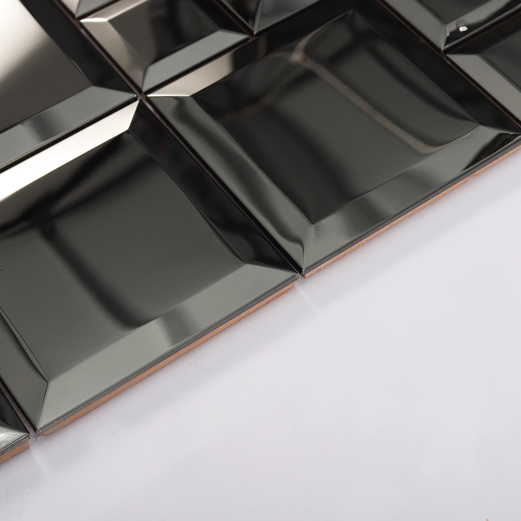 Side view of black mirror stainless steel beveled tiles showing thickness and edge detail