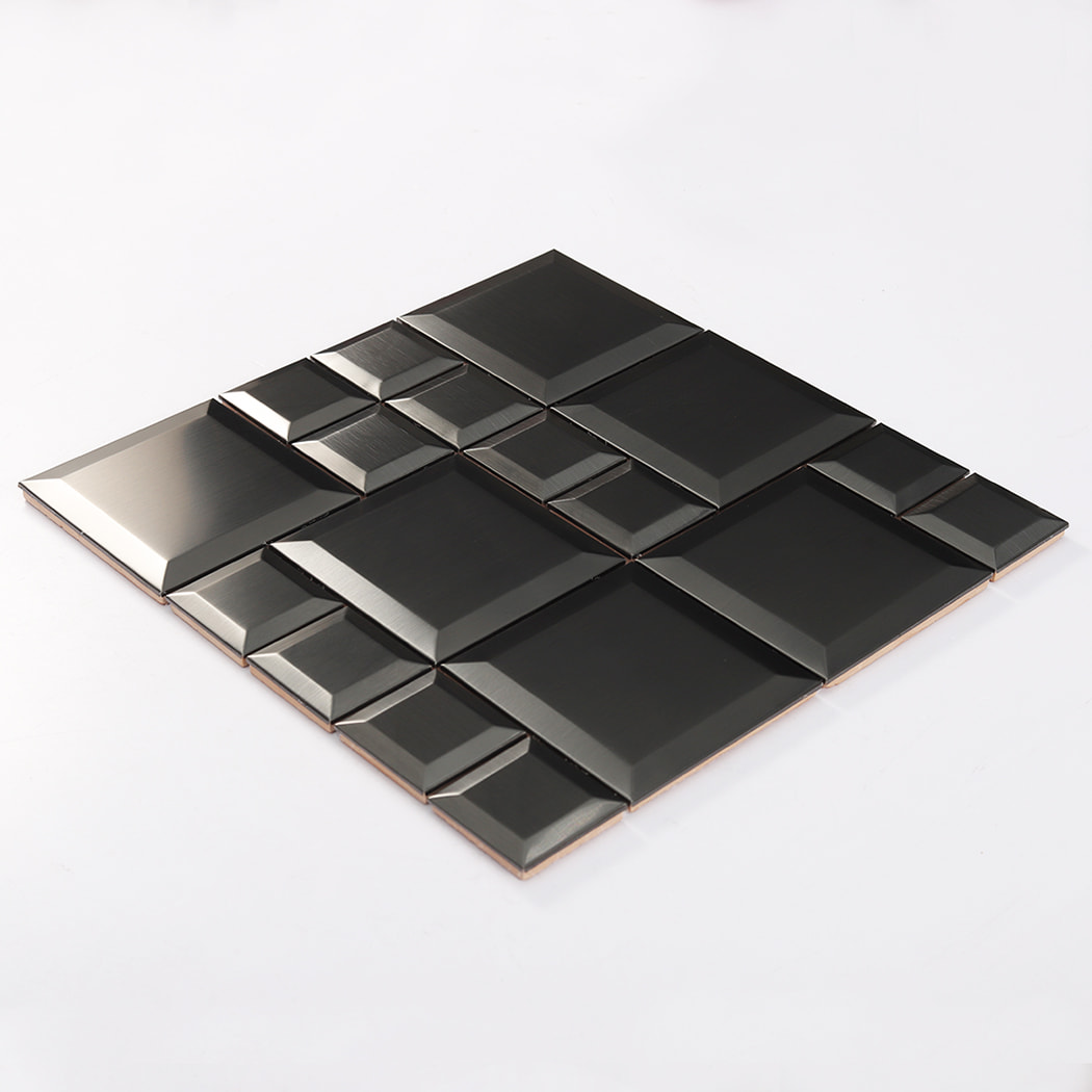 Angled view of black stainless steel beveled mosaic tile highlighting depth and shadows