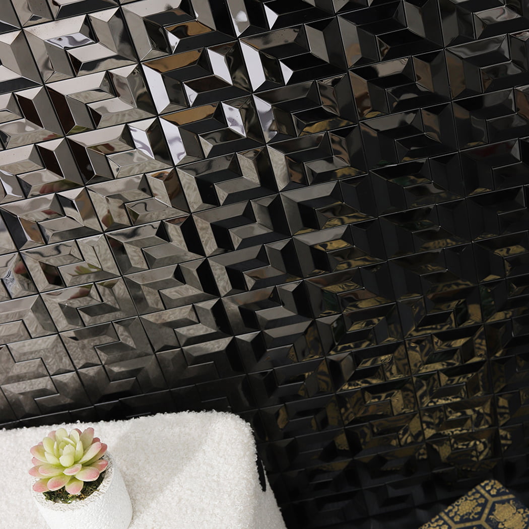 Close up of black stainless steel mosaic metal tile wall with reflective 3D pattern