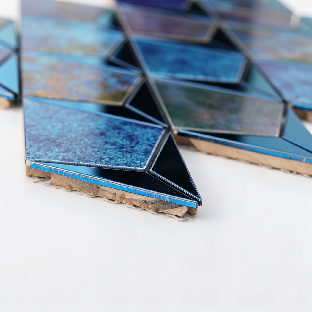 Side view showing the thickness of blue aluminum and stainless steel mosaic tiles
