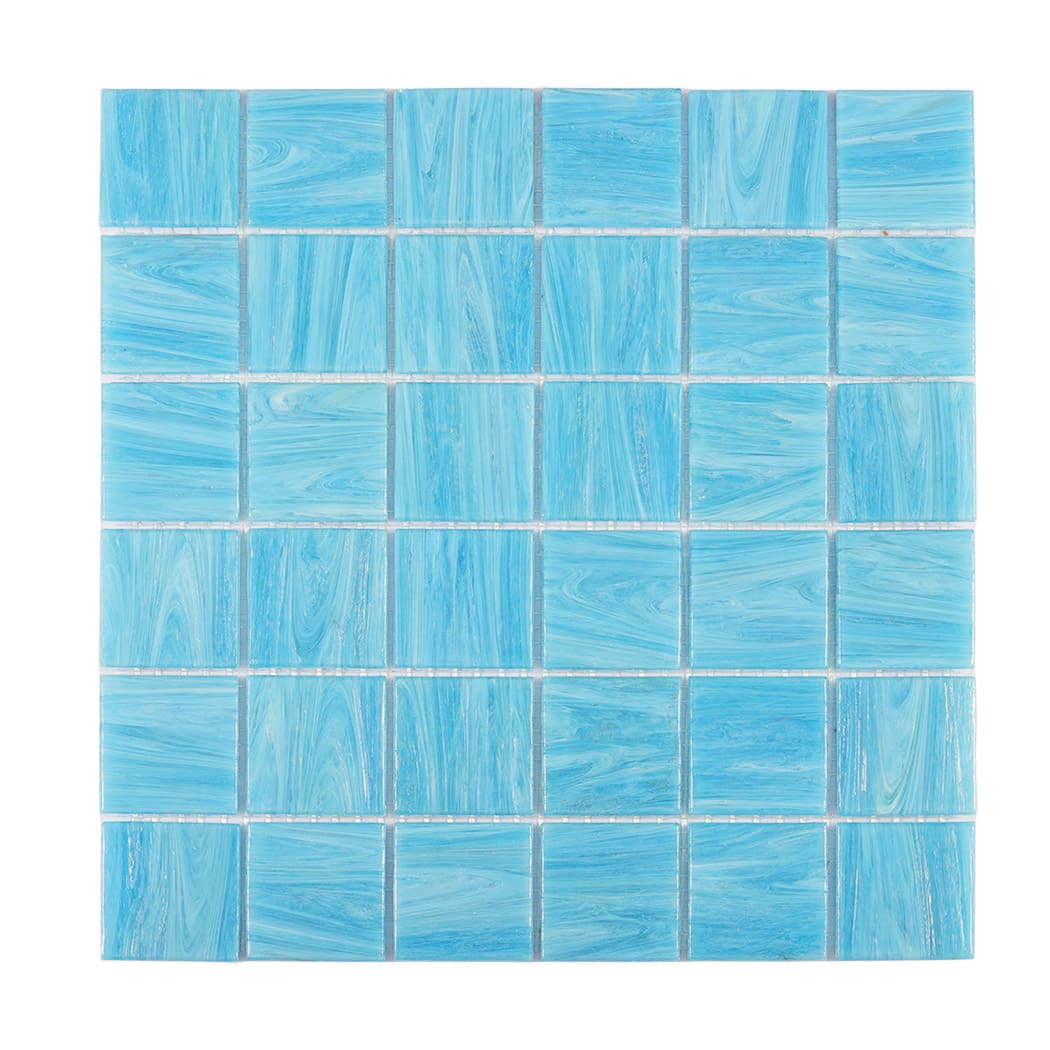 Front view of blue glass mosaic tile sheet on white background