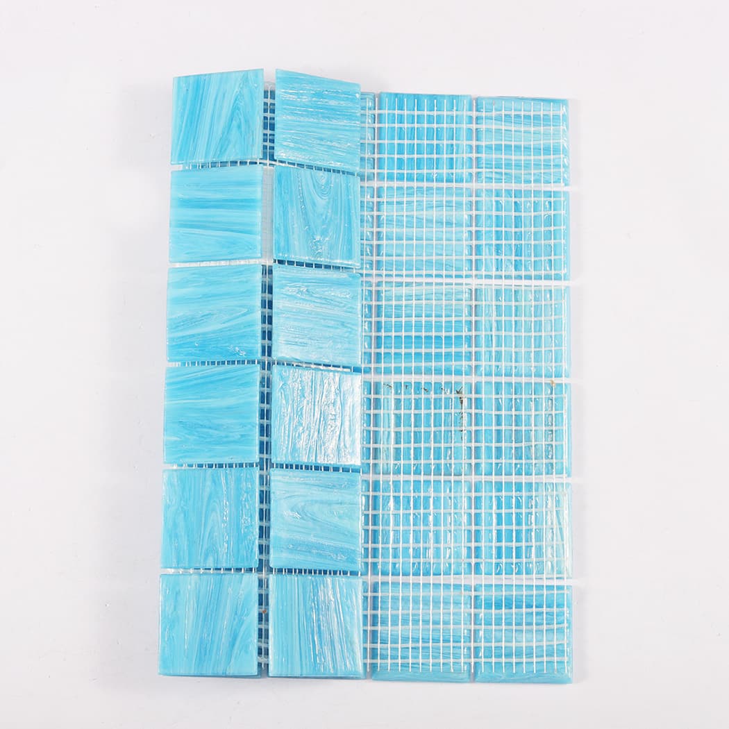 Back view showing mesh backing of blue glass mosaic tile sheet