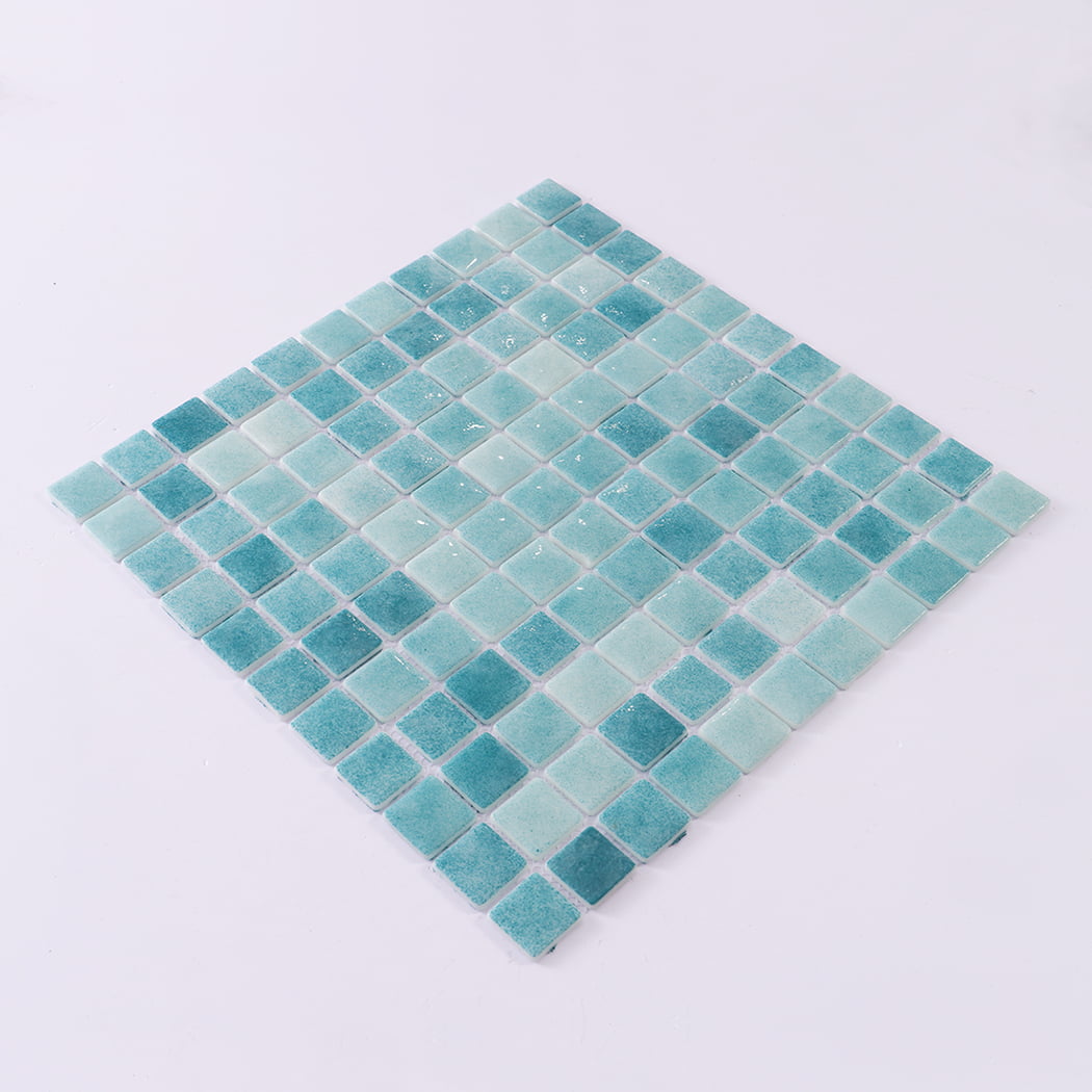 Angled display of a blue green recycled glass mosaic tile sheet.