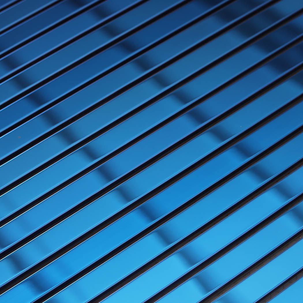 Close-up of blue mirror stainless steel linear tile strips
