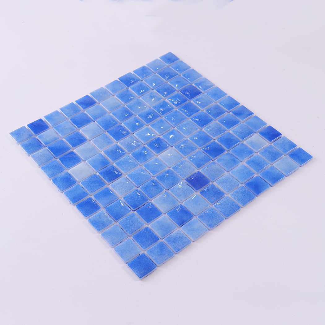 Angled display of a blue recycled glass mosaic tile sheet.