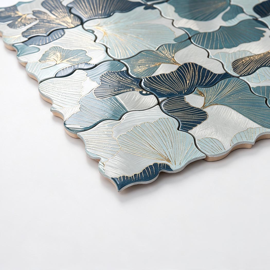 Angled close-up of blue and silver floral aluminum mosaic tile with engraved petals
