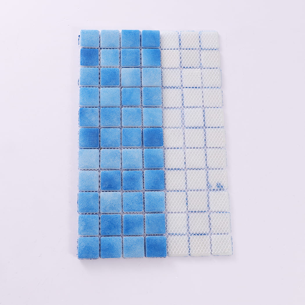 Backside view of blue recycled glass mosaic pool tile sheet with mesh backing