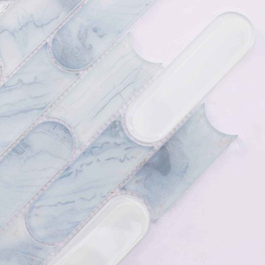 Close up of blue patterned and white capsule shaped glass mosaic tiles